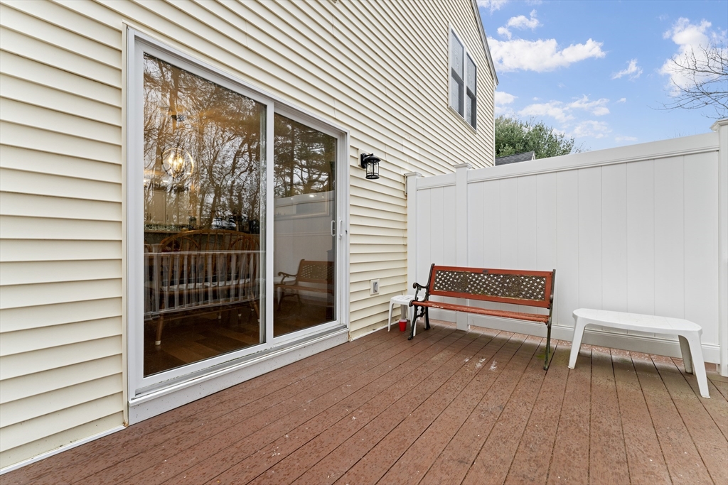 7 Millers Way, Unit C Sutton, MA 01590 - Photo 4 of 28 a view of a terrace with lounge chair and a floor to ceiling window