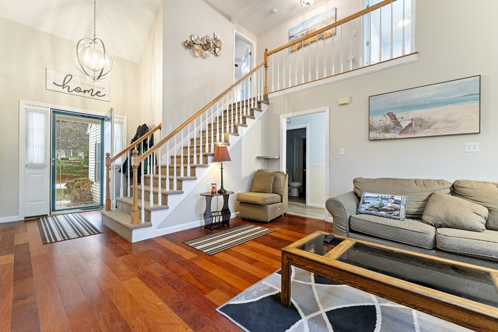 7 Millers Way, Unit C Sutton, MA 01590 - Photo 7 of 28 a living room with furniture and a table with wooden floor