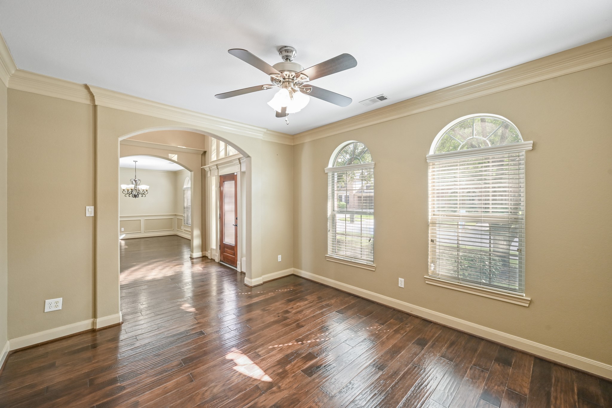 12527 Cape Sable Court Humble, TX 77346 - Photo 11 of 39 a view of empty room with wooden floor and fan