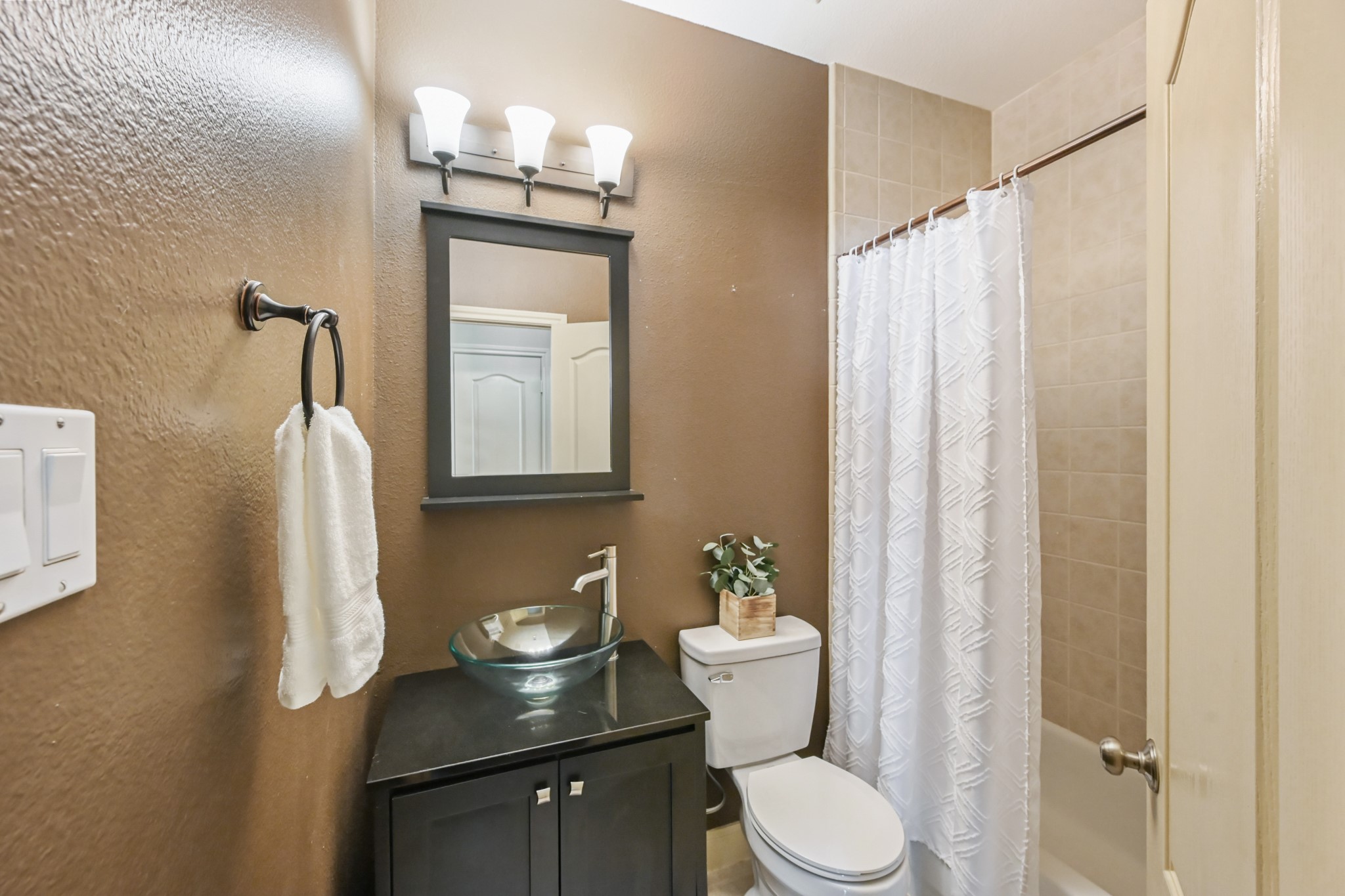 12527 Cape Sable Court Humble, TX 77346 - Photo 13 of 39 a bathroom with a granite countertop sink toilet and mirror