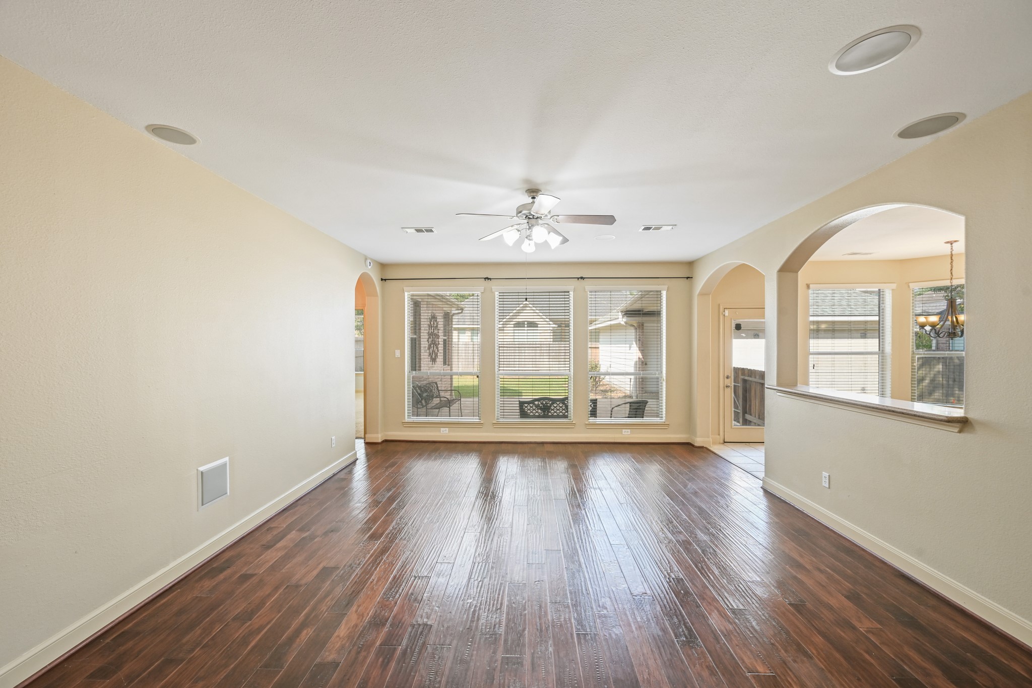 12527 Cape Sable Court Humble, TX 77346 - Photo 15 of 39 a view of an empty room with a window and wooden floor