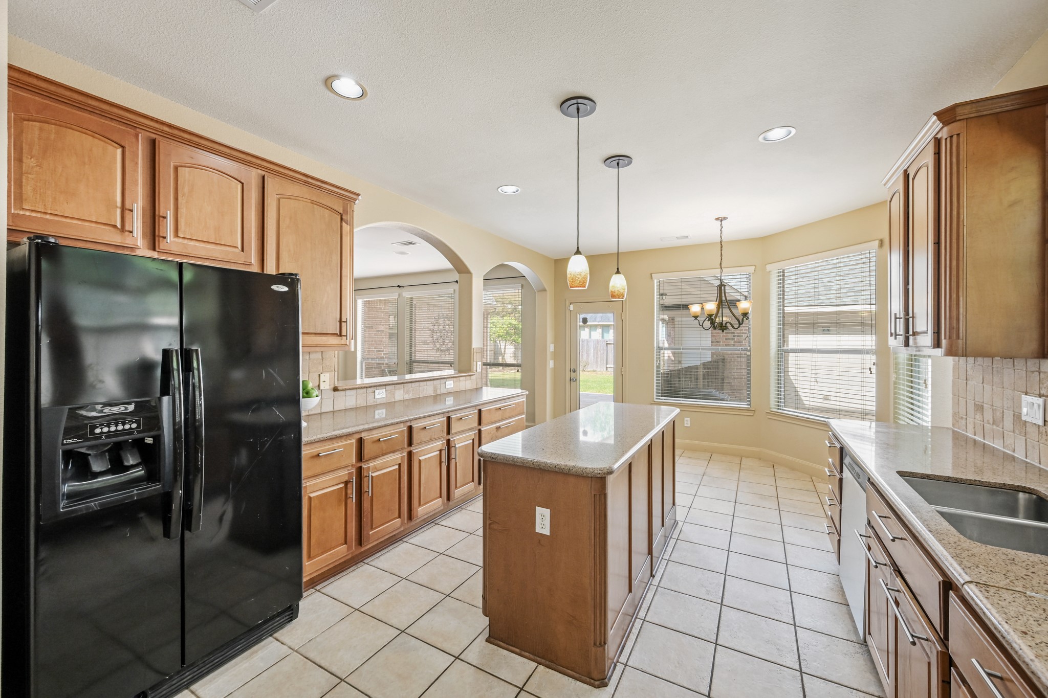 12527 Cape Sable Court Humble, TX 77346 - Photo 19 of 39 a open kitchen with stainless steel appliances granite countertop a refrigerator a oven and a sink