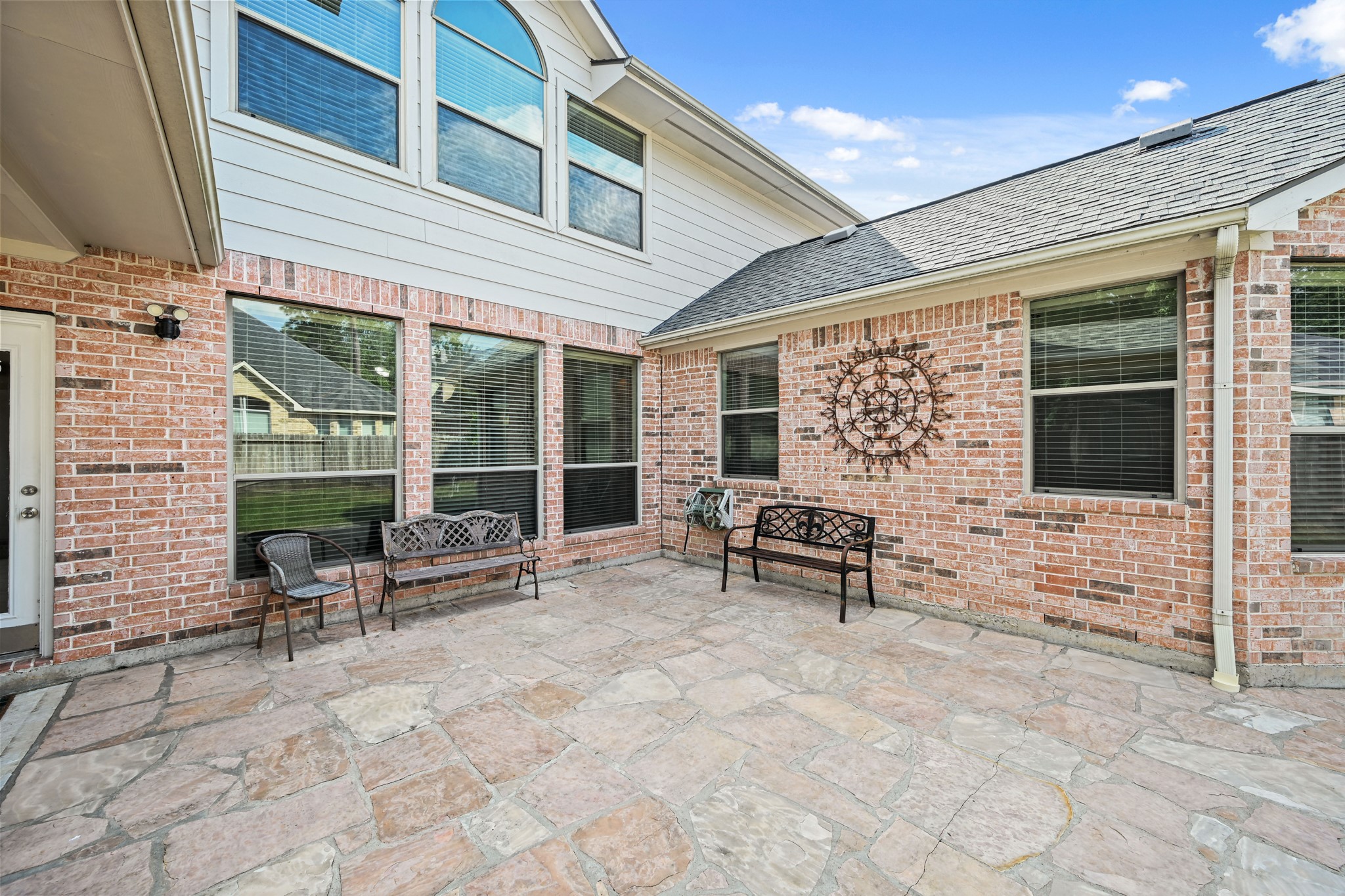 12527 Cape Sable Court Humble, TX 77346 - Photo 2 of 39 a building outdoor space with patio furniture and potted plants