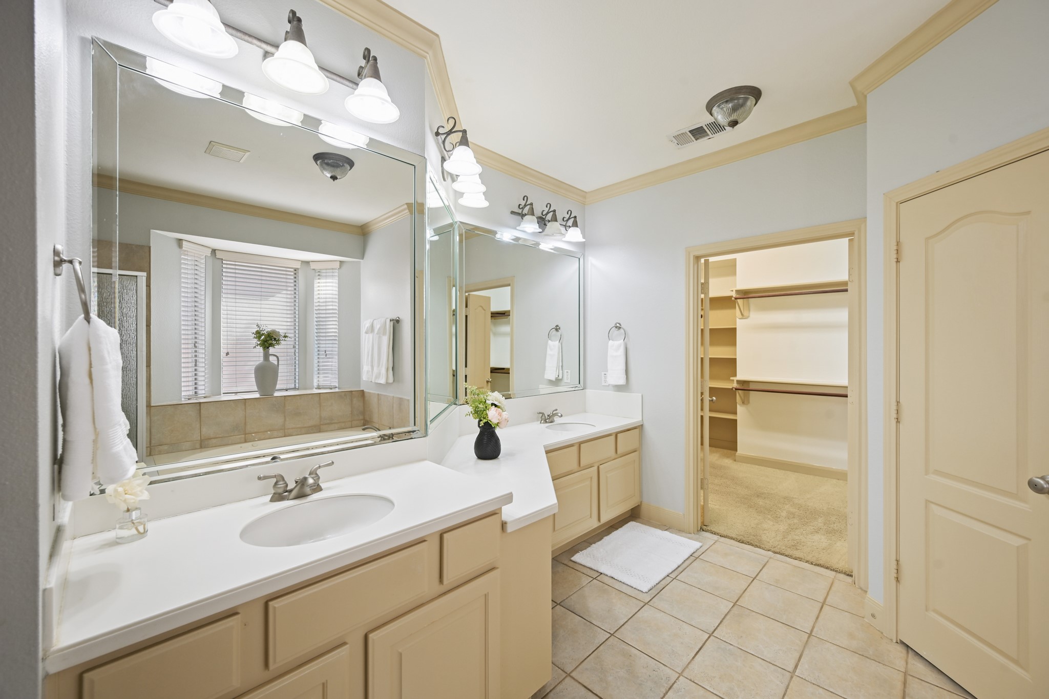 12527 Cape Sable Court Humble, TX 77346 - Photo 25 of 39 a bathroom with a sink a large mirror and a shower