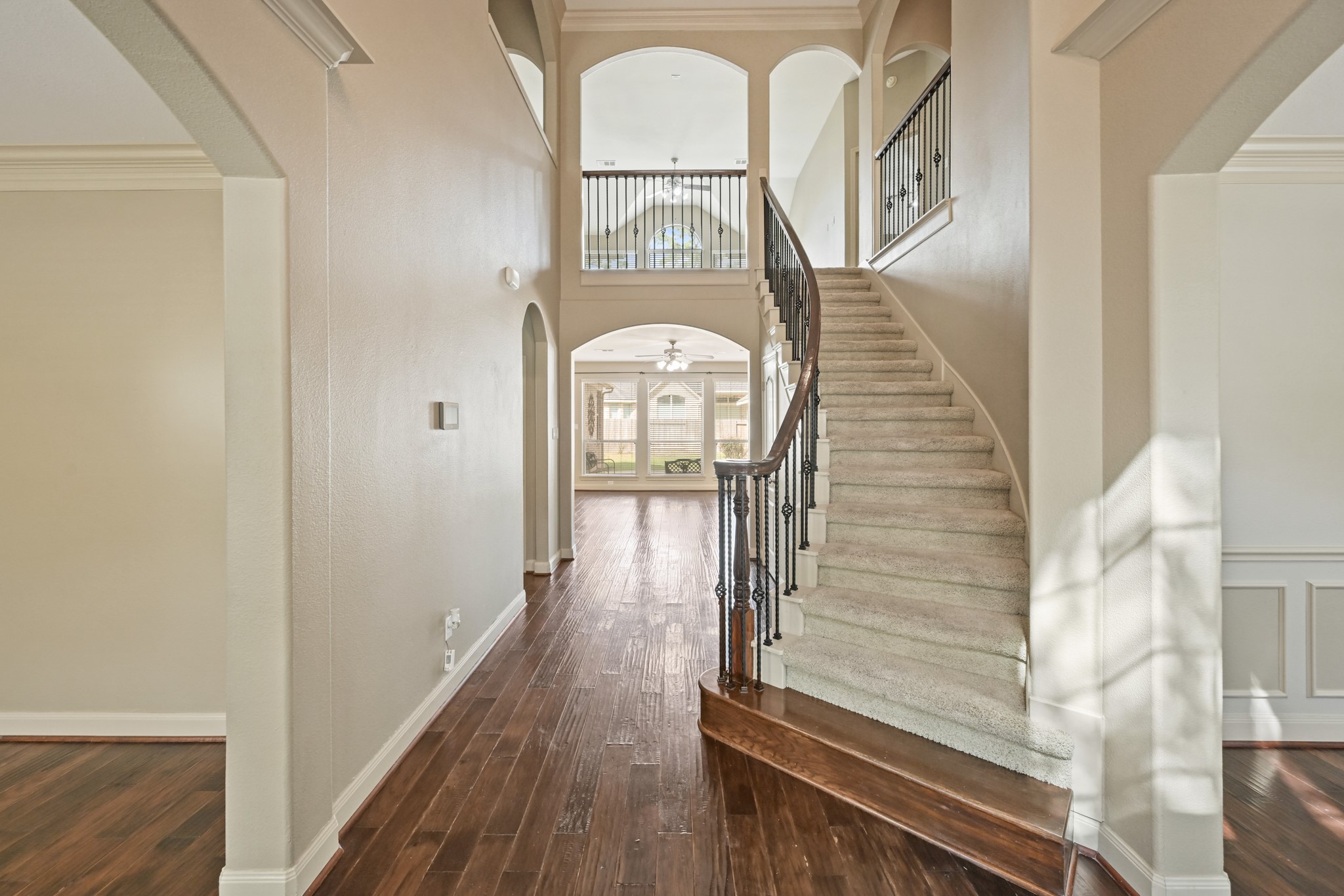 12527 Cape Sable Court Humble, TX 77346 - Photo 4 of 39 a view of a hallway with wooden floor and entryway