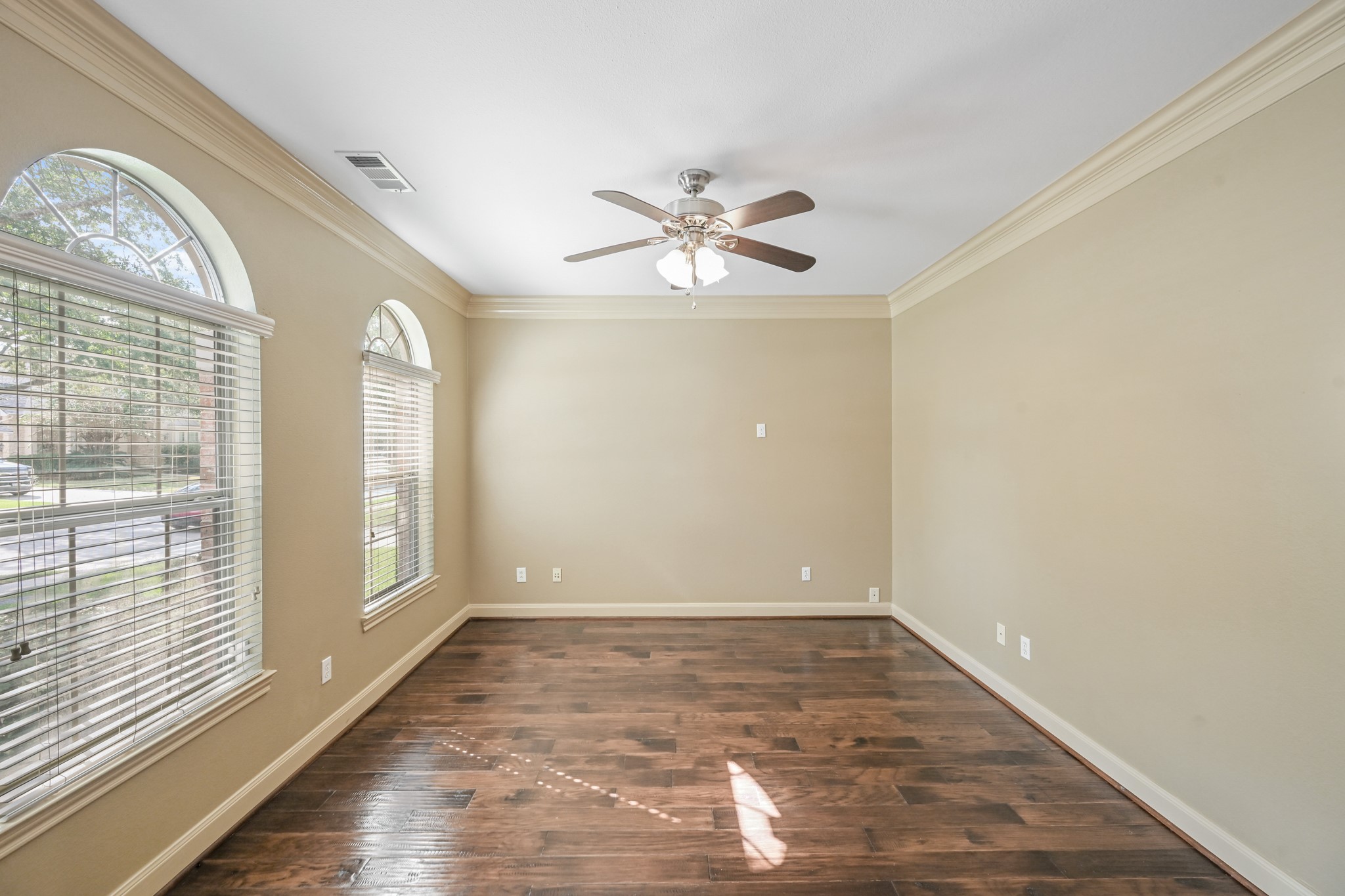 12527 Cape Sable Court Humble, TX 77346 - Photo 10 of 39 wooden floor in an empty room with a window