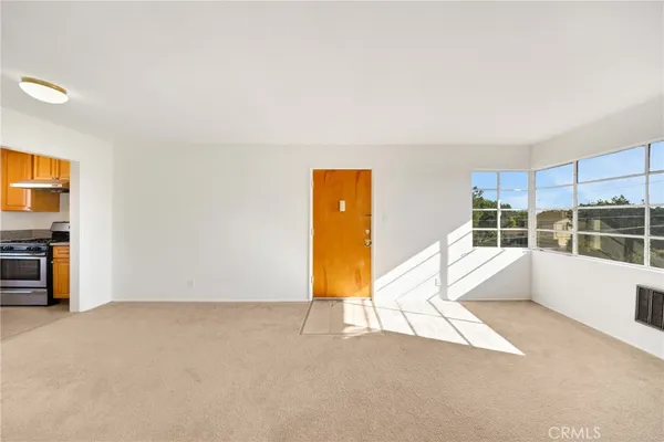 a view of an empty room with a window