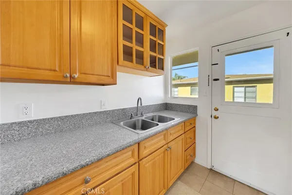 a kitchen with a sink and cabinets