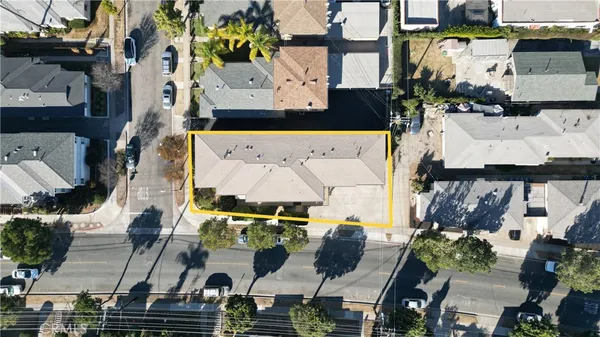 an aerial view of multiple houses with outdoor space