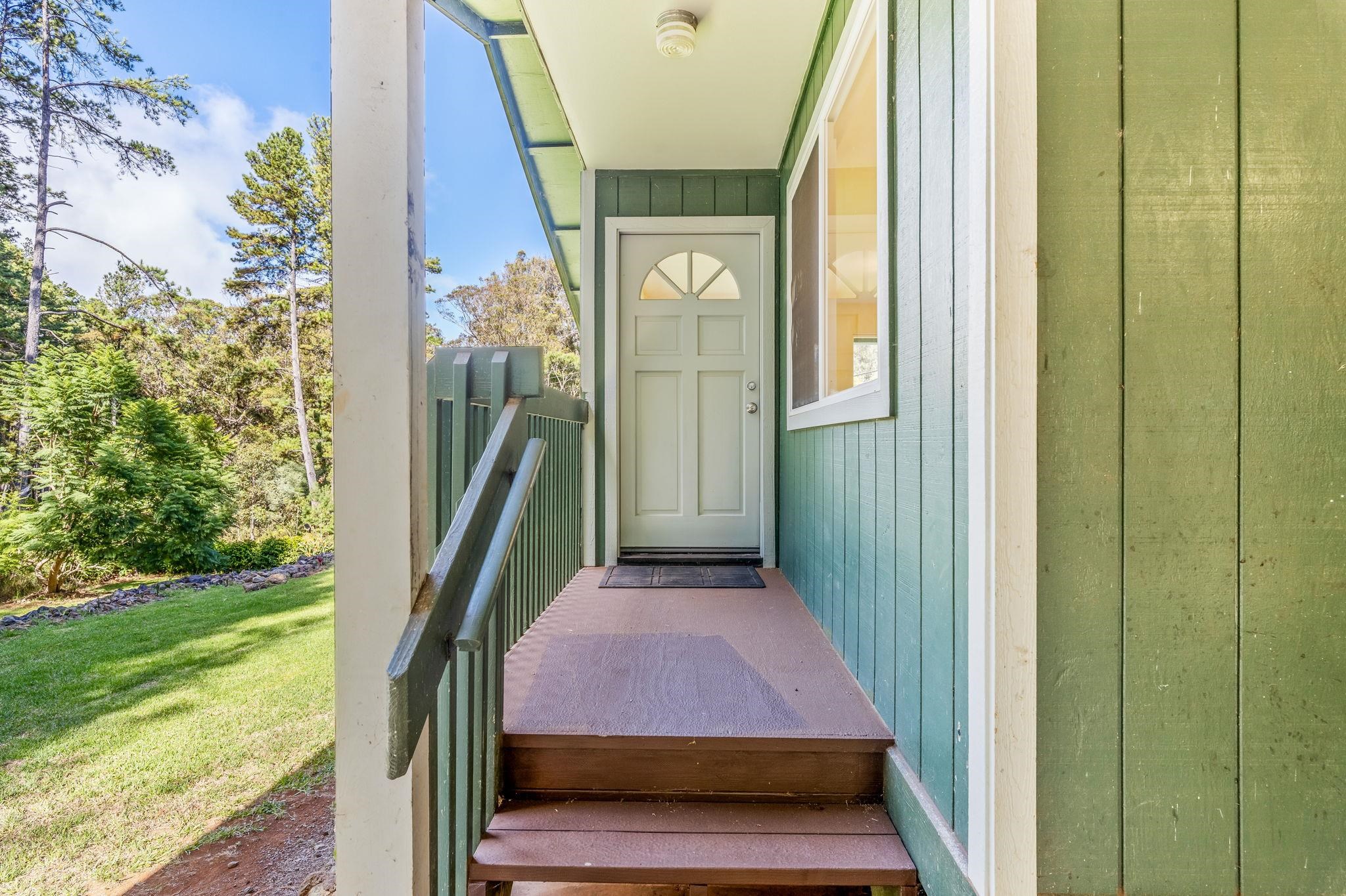 2640 Olinda Road Makawao, HI 96768 - Photo 28 of 49 a front view of a house with a garden