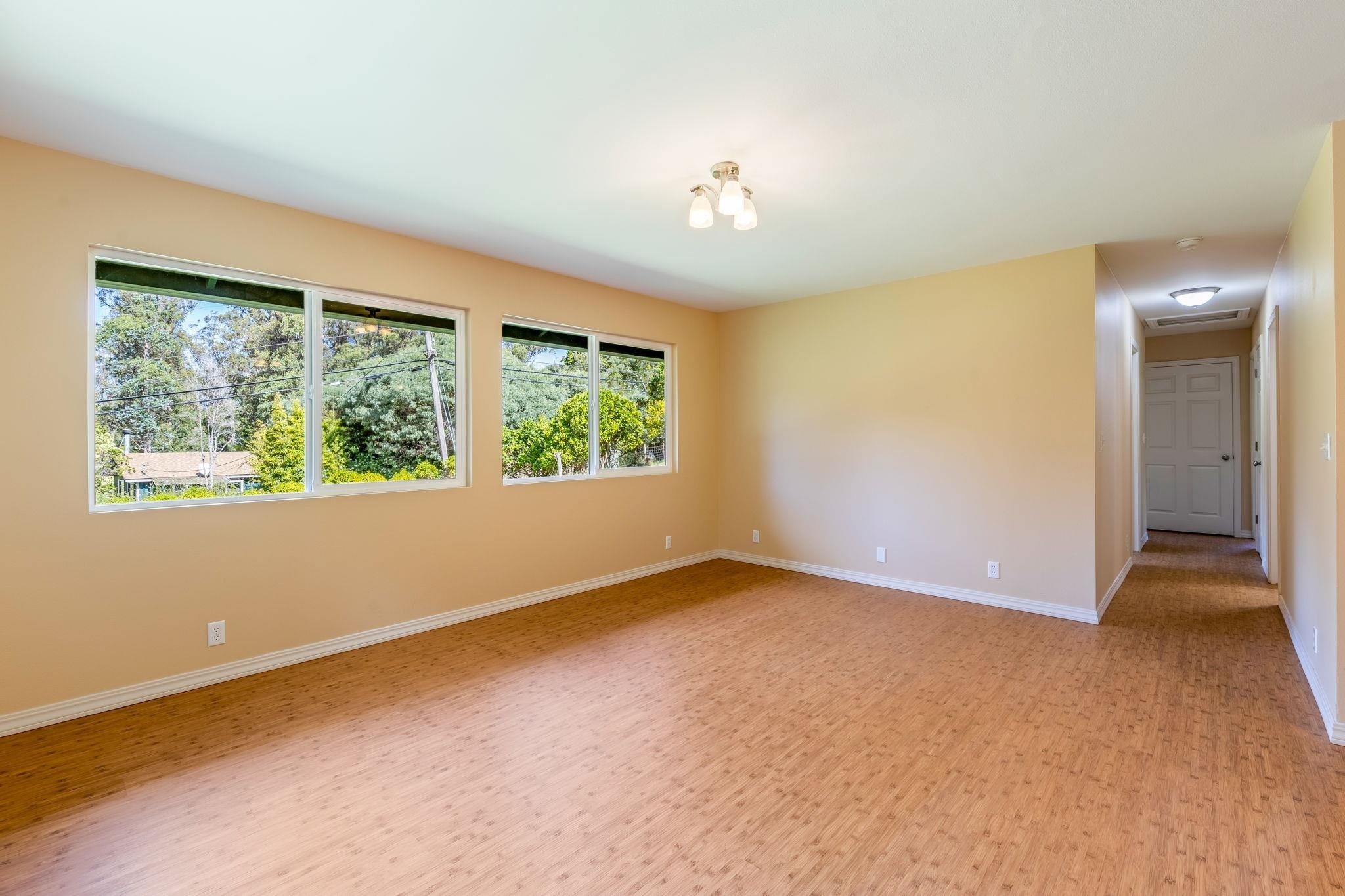 2640 Olinda Road Makawao, HI 96768 - Photo 29 of 49 an empty room with wooden floor and windows