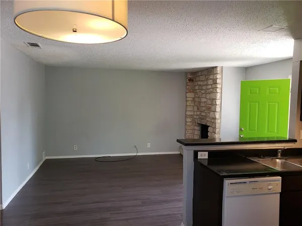 a room with a sink and a mirror