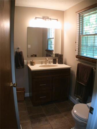 140 Bay State Road Worcester, MA 01605 - Photo 15 of 17 a bathroom with a sink vanity mirror and toilet