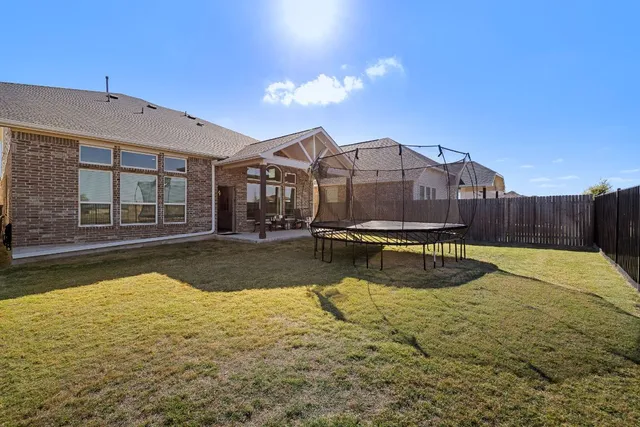a view of a swimming pool with a lounge chairs