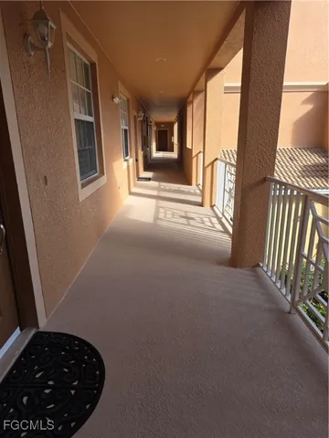 a view of a hallway with windows