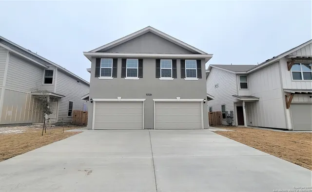 a view of a house with a garage