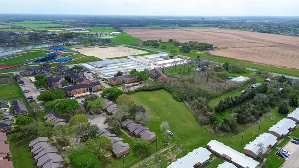 an aerial view of a house with a garden