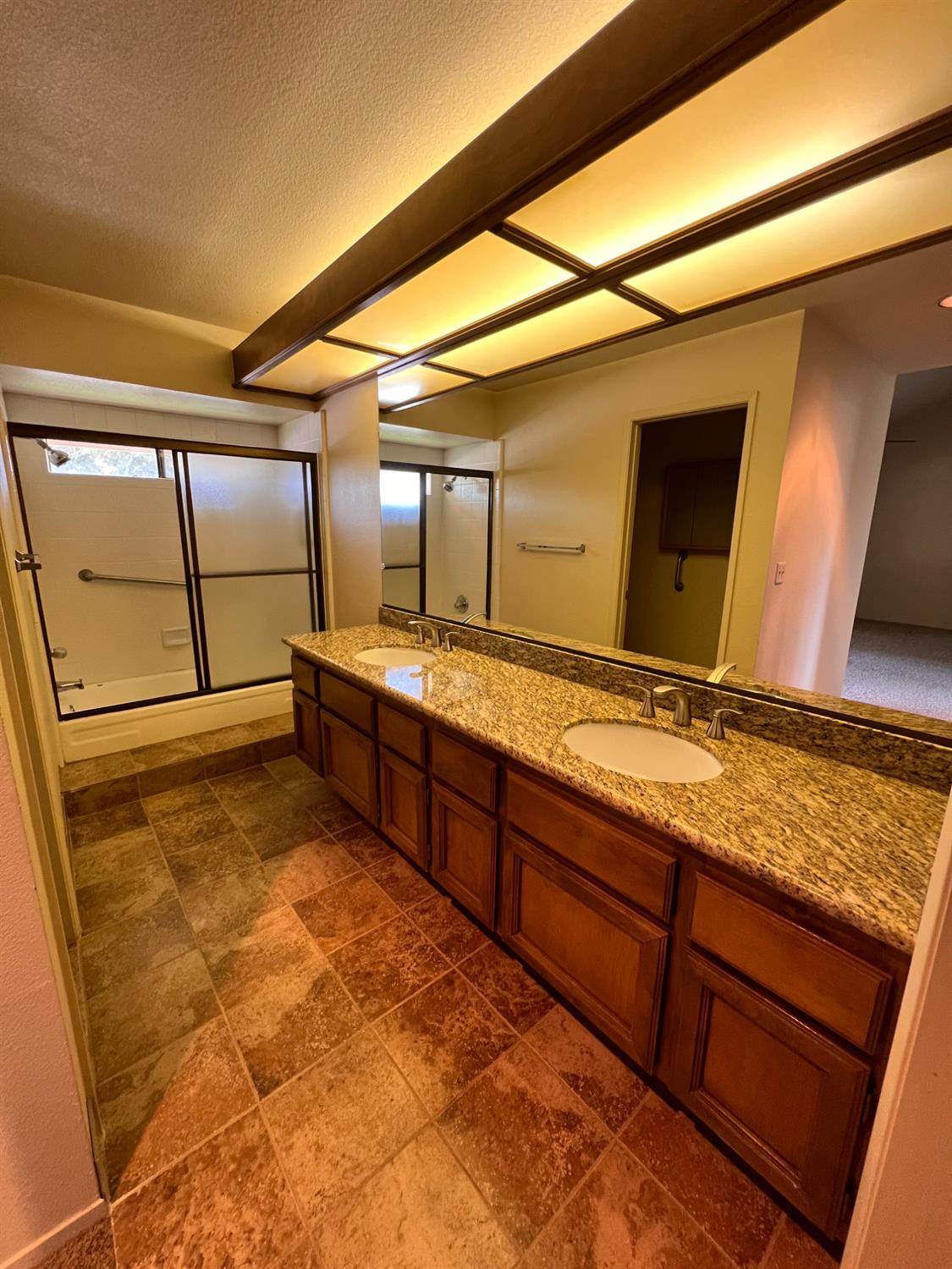 1417 West Swain Road Stockton, CA 95207 - Photo 12 of 18 a bathroom with a sink and a mirror
