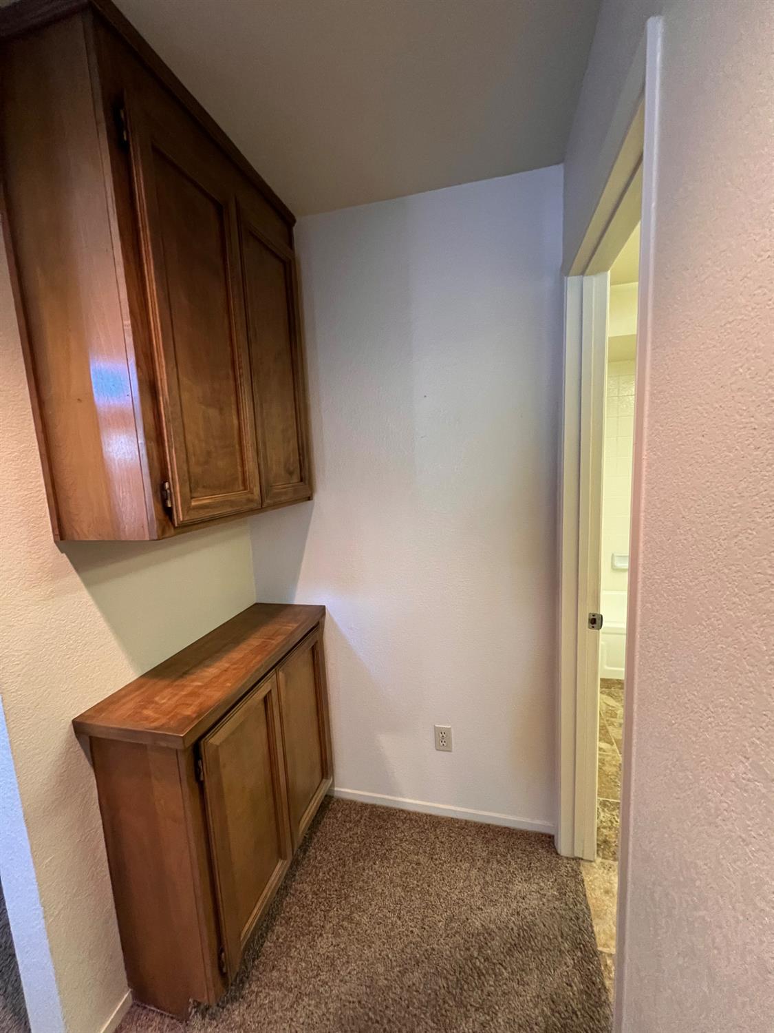 1417 West Swain Road Stockton, CA 95207 - Photo 16 of 18 a view of a storage and utility room with wooden floor