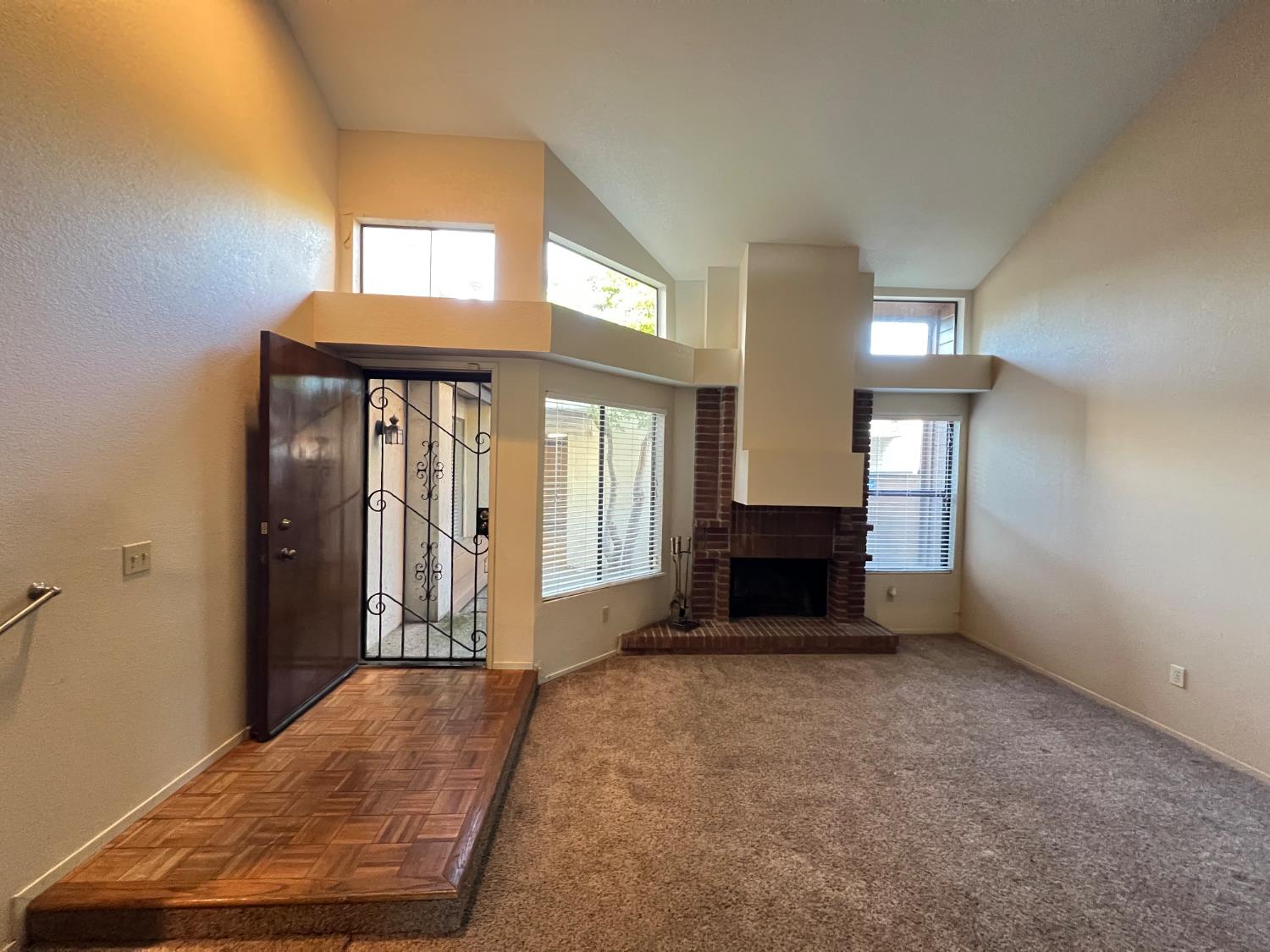 1417 West Swain Road Stockton, CA 95207 - Photo 18 of 29 an entryway with fireplace and windows