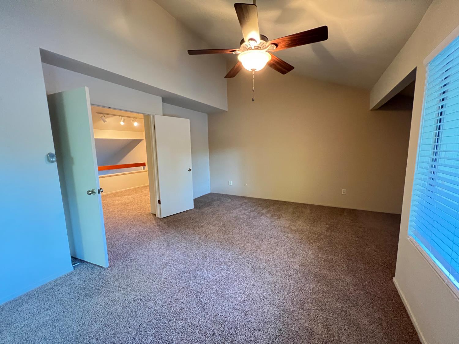 1417 West Swain Road Stockton, CA 95207 - Photo 25 of 29 a view of a livingroom with a ceiling fan and window
