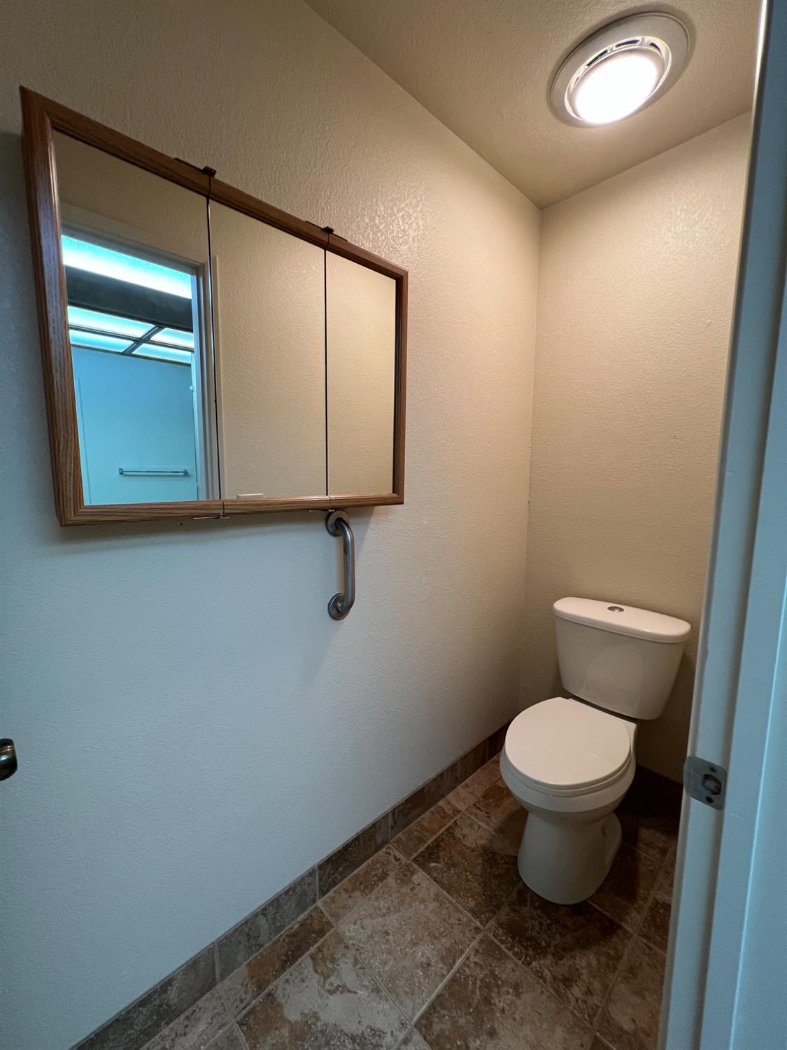 1417 West Swain Road Stockton, CA 95207 - Photo 29 of 29 a bathroom with a toilet