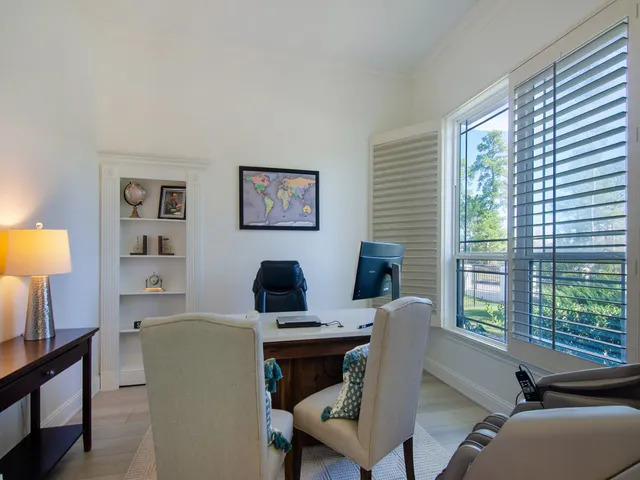 a work room with furniture and a window
