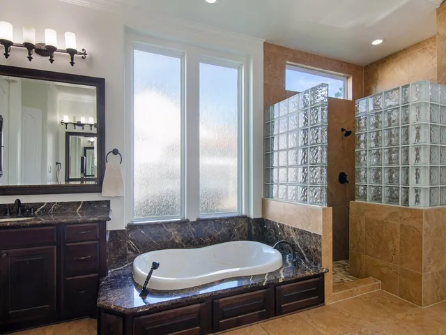 a bathroom with a tub and a sink
