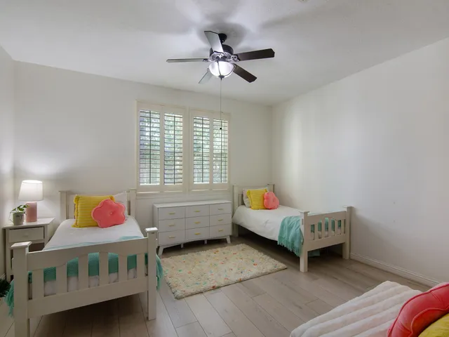 a bedroom with furniture and window