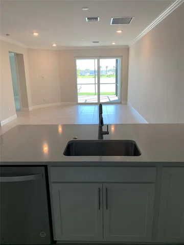 a kitchen with a sink and window