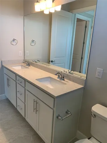 a bathroom with a sink and a toilet