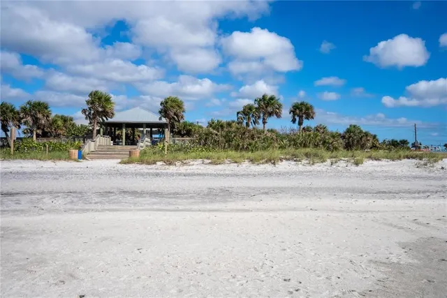 a view of a fountain in front of a house