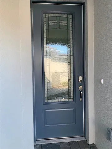 a view of a glass door of the house