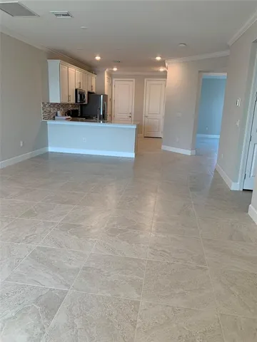 a view of a kitchen and kitchen with a sink