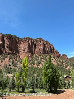 a view of a large building with a mountain in the background