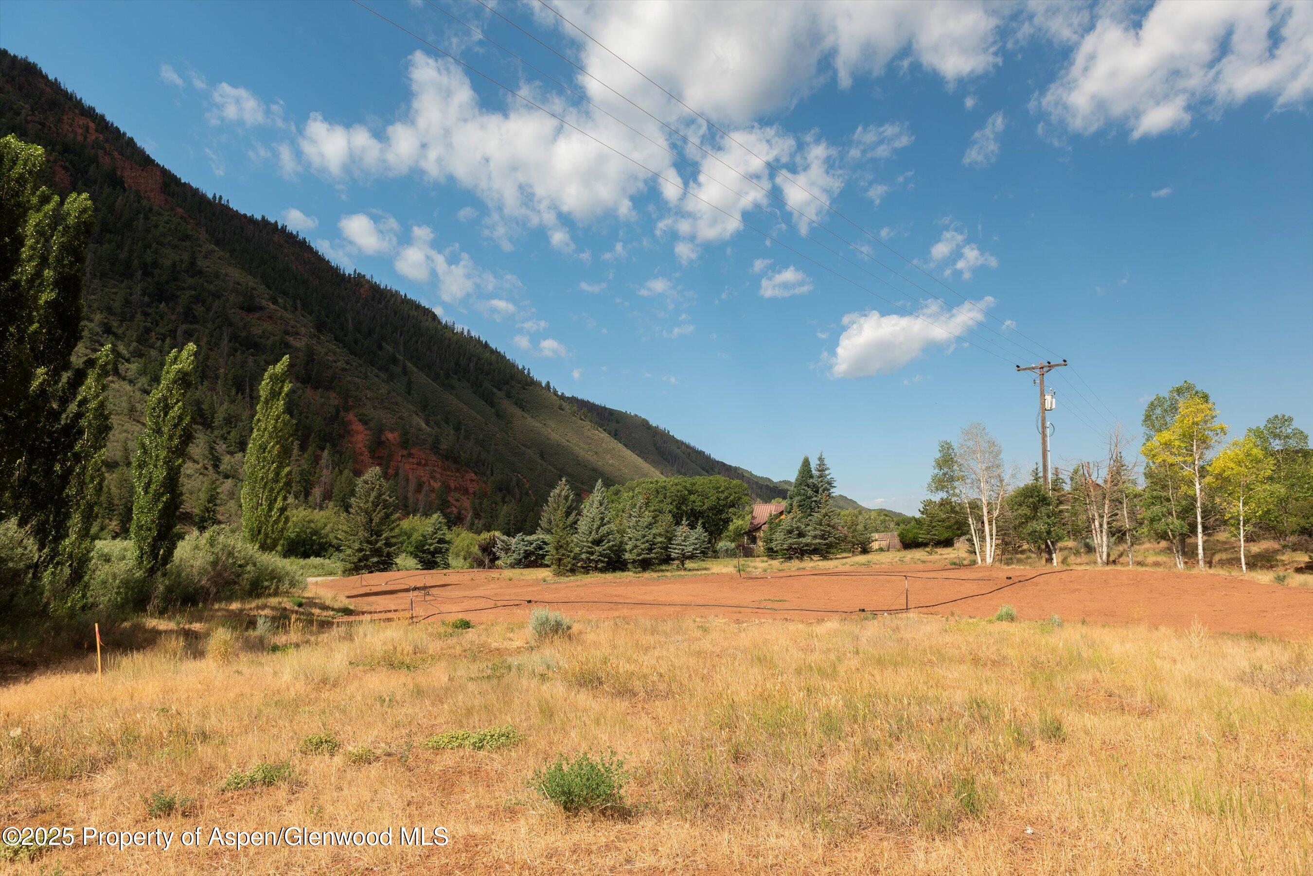 4959 Frying Pan Road Basalt, CO 81621 - Photo 16 of 20 a view of swimming pool with an outdoor space and seating area