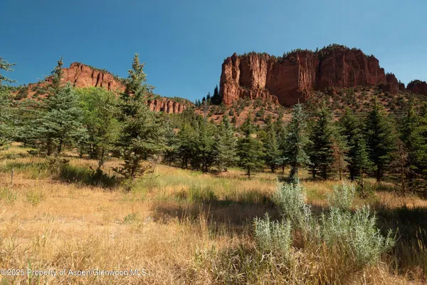 a view of a lake with a building in the background