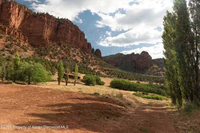 a view of a road with a building in the background
