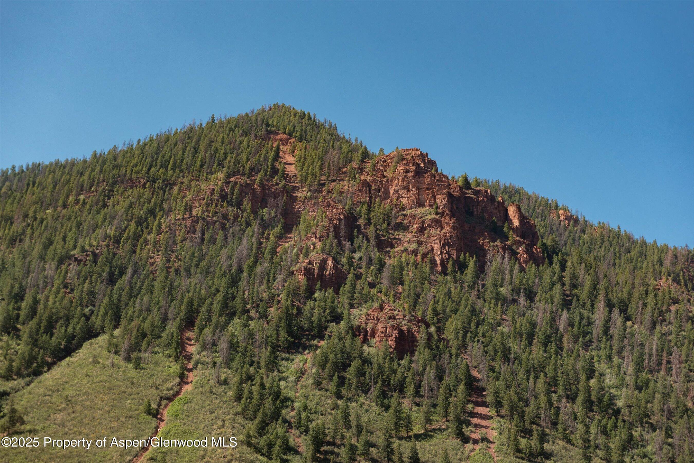4959 Frying Pan Road Basalt, CO 81621 - Photo 5 of 20 a view of a large building with a mountain in the background
