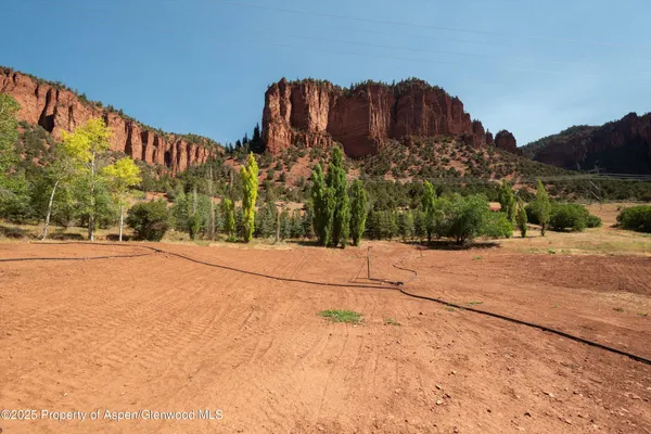 a view of a street with a building in the background