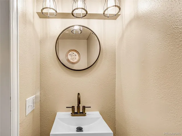 a bathroom with a toilet and a sink