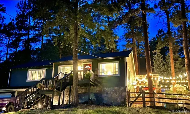 a view of a house with a tree
