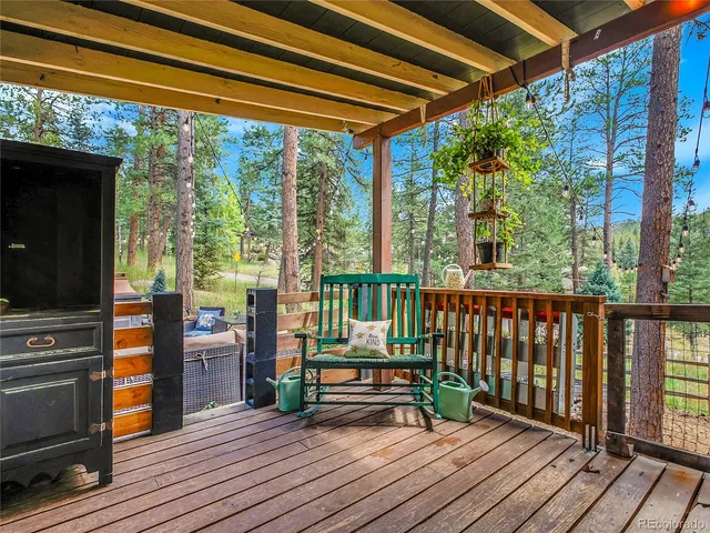 a view of balcony with wooden floor and furniture