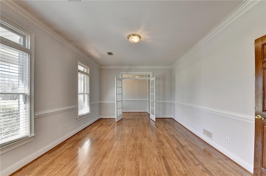 1622 New Hope Road Lawrenceville, GA 30045 - Photo 14 of 110 a view of empty room with wooden floor and fan