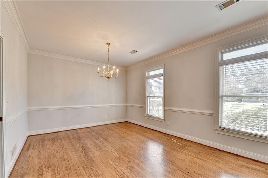 1622 New Hope Road Lawrenceville, GA 30045 - Photo 18 of 110 wooden floor in an empty room with a window