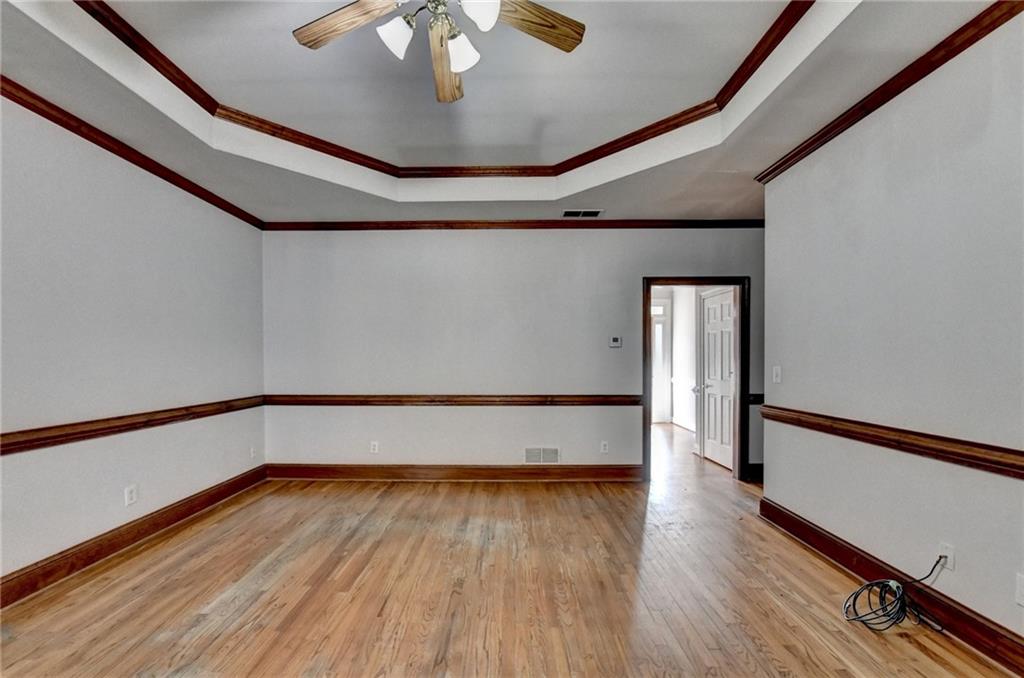 1622 New Hope Road Lawrenceville, GA 30045 - Photo 19 of 110 a view of an empty room with wooden floor and a window