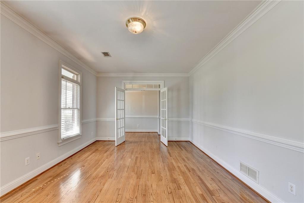 1622 New Hope Road Lawrenceville, GA 30045 - Photo 21 of 110 a view of empty room with wooden floor and fan