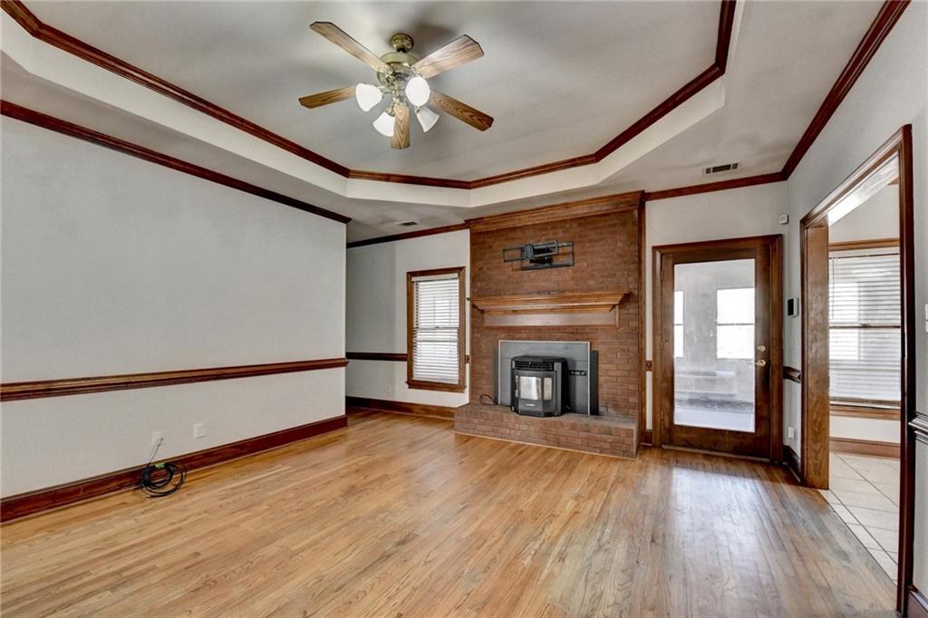 1622 New Hope Road Lawrenceville, GA 30045 - Photo 23 of 110 a view of an empty room with exposed radiator and fireplace