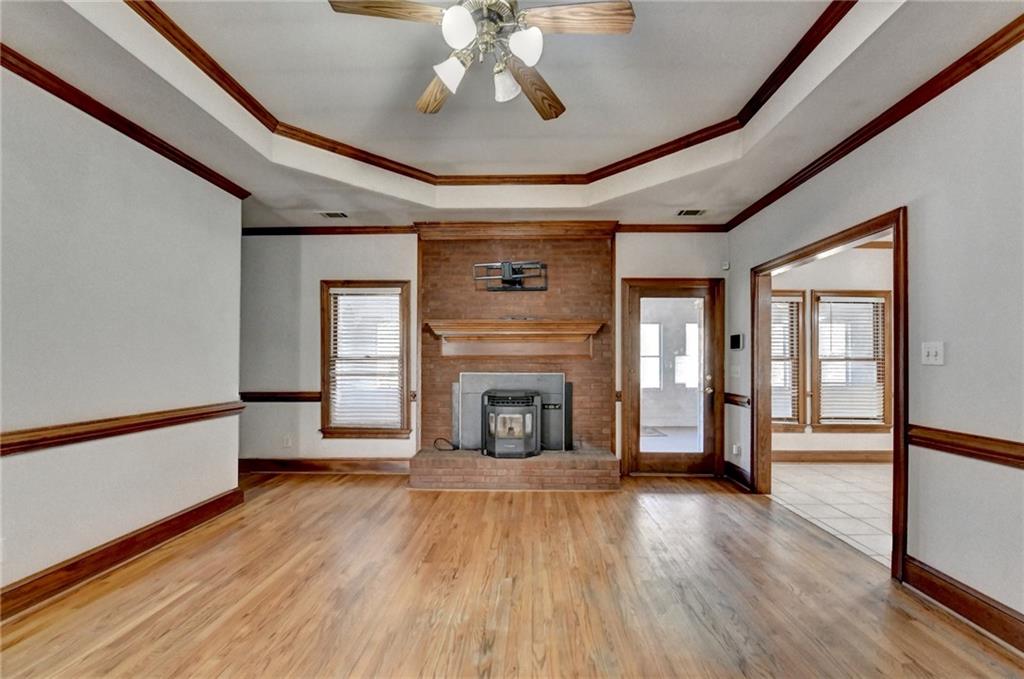1622 New Hope Road Lawrenceville, GA 30045 - Photo 25 of 110 a view of a livingroom with a fireplace wooden floor and windows