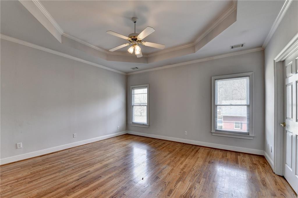 1622 New Hope Road Lawrenceville, GA 30045 - Photo 45 of 110 a view of an empty room with wooden floor and a window
